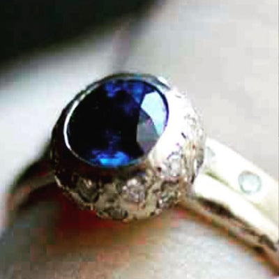 2-carat color-changing sapphire engagement ring Inspired by the thistle flower,
